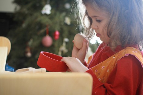 girl opening Christmas present